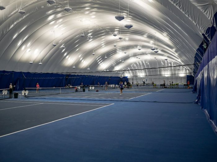 Bubble dome interior with tennis courts